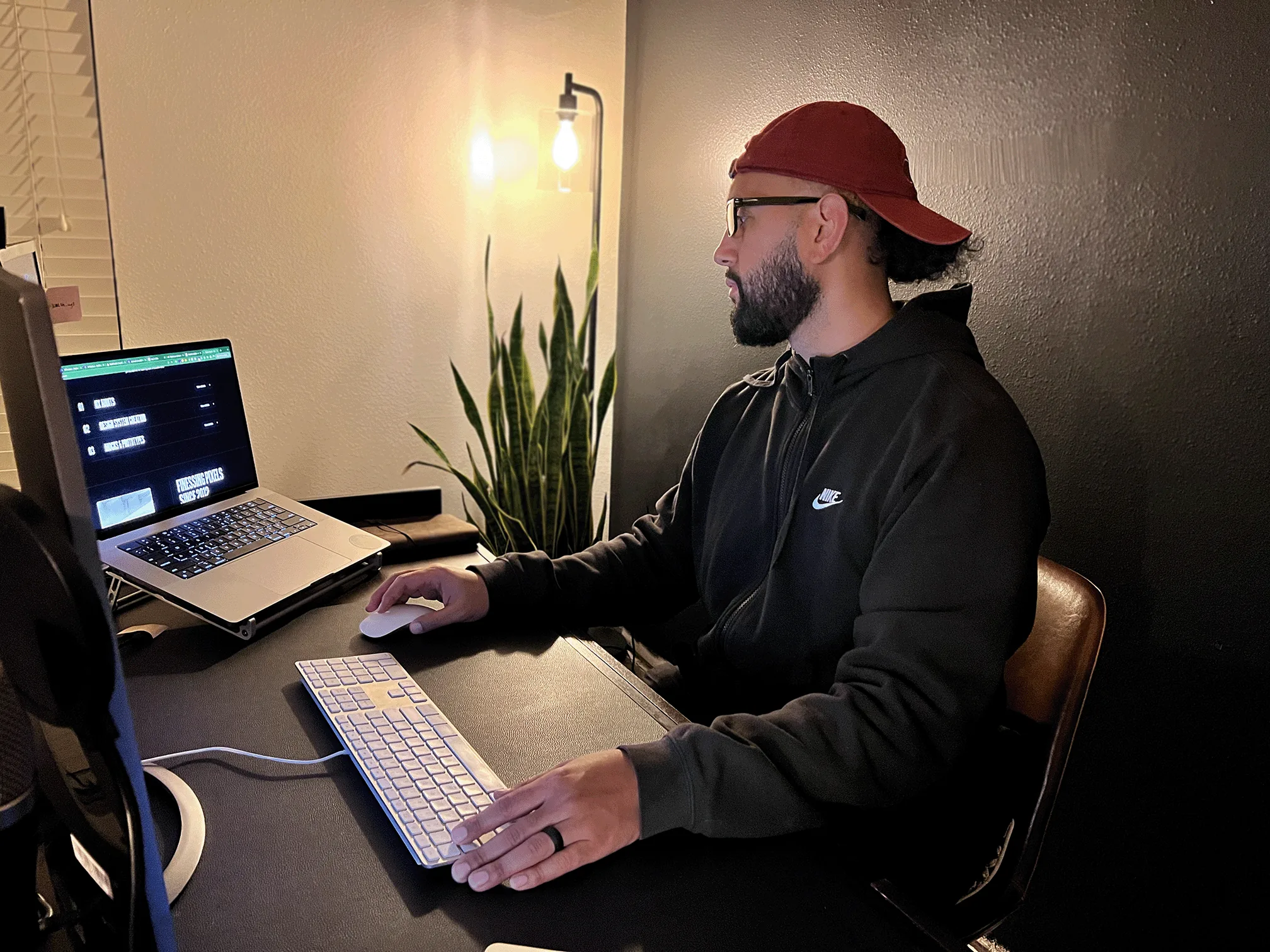 Lo working at his desk